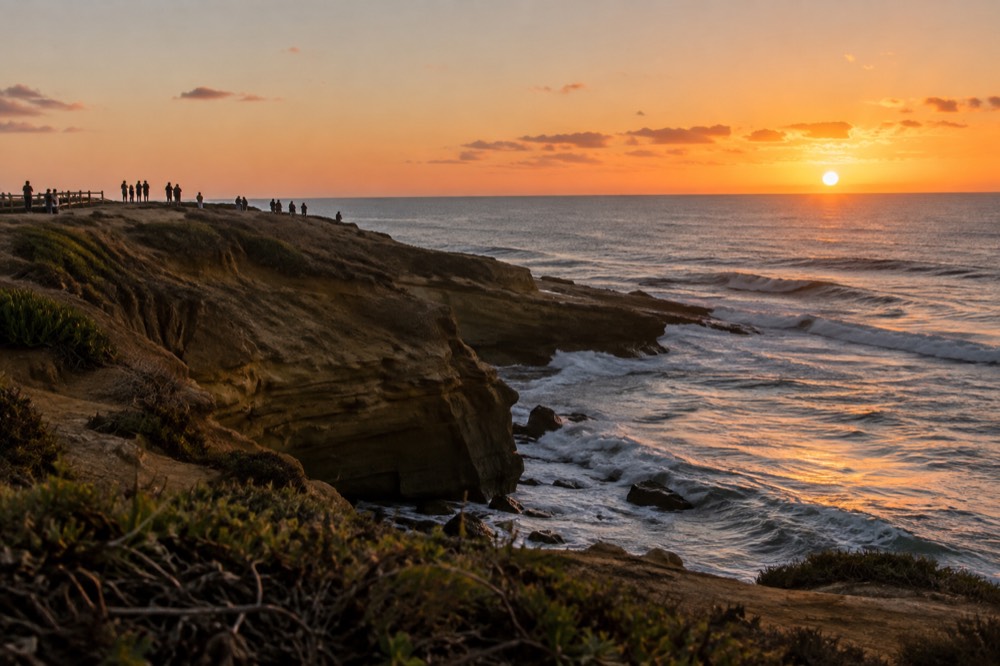 Sunset over the ocean at Sunset Cliffs with silhouetted watchers