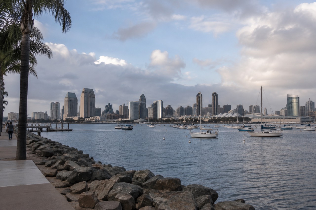 San Diego skyline across the bay with moored sailboats in the foreground