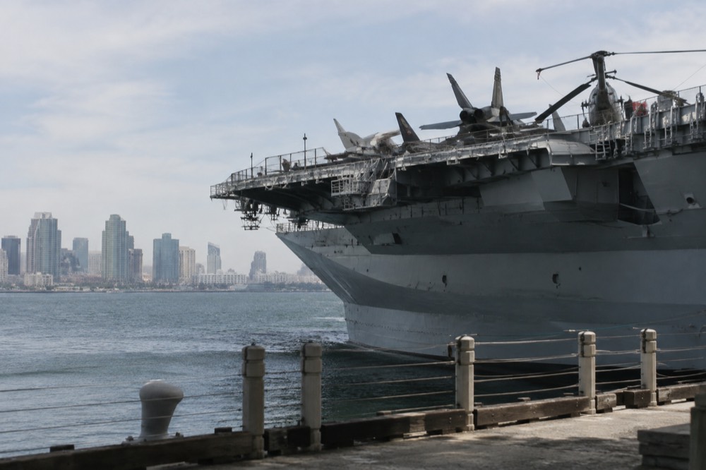 Aircraft carrier flight deck with downtown San Diego across the bay